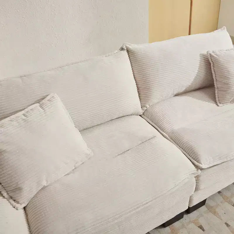 Divanetto letto in velluto a coste, profondo e imbottito, con cuscini