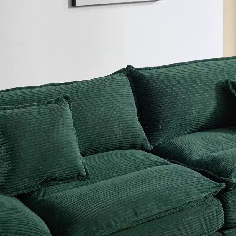 Divanetto letto in velluto a coste, profondo e imbottito, con cuscini