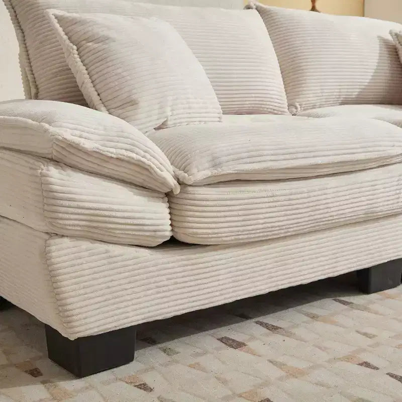Divanetto letto in velluto a coste, profondo e imbottito, con cuscini