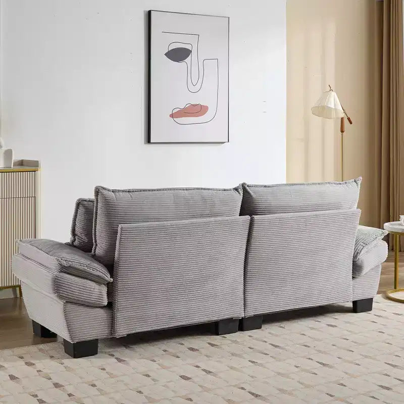 Divanetto letto in velluto a coste, profondo e imbottito, con cuscini